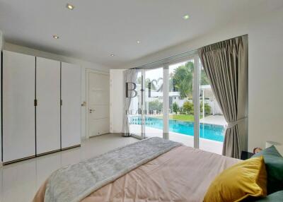 Modern bedroom with pool view