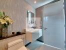 Modern bathroom with floating vanity and textured wall