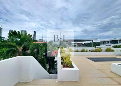 Outdoor terrace with plants and city view