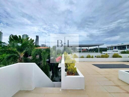 Outdoor terrace with plants and city view