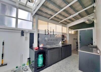 Bright kitchen space with appliances and countertop