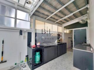 Bright kitchen space with appliances and countertop