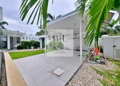 Covered patio area with garden and play set