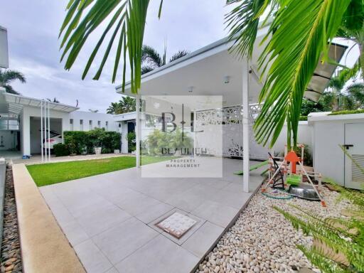 Covered patio area with garden and play set