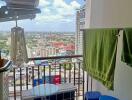 High-rise balcony view with air conditioning units and laundry area