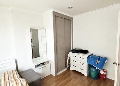 Cozy bedroom with wooden flooring and furniture