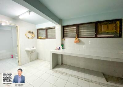 Spacious bathroom with large counter and sink