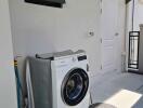 Outdoor laundry area with washing machine