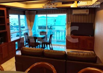 Spacious living room with large glass doors leading to a balcony