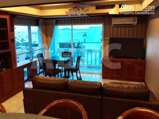 Spacious living room with large glass doors leading to a balcony