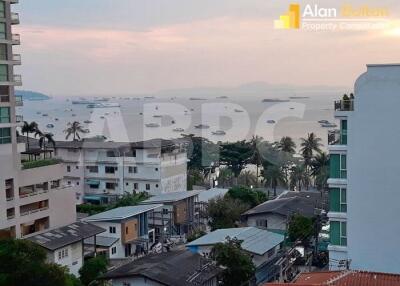 View of residential and commercial buildings near the waterfront during sunset