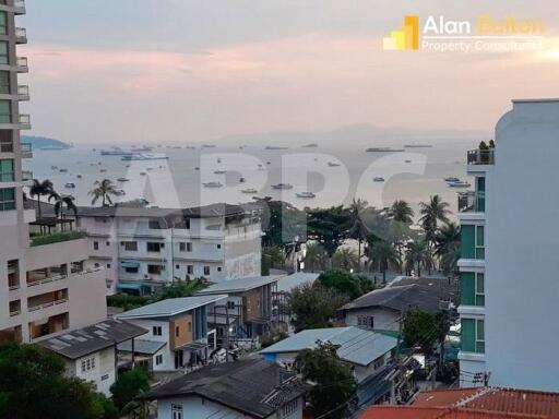 View of residential and commercial buildings near the waterfront during sunset