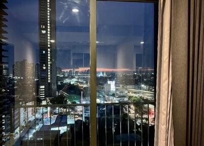 Night view of city skyline from balcony