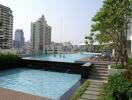 Outdoor swimming pool view with cityscape in the background