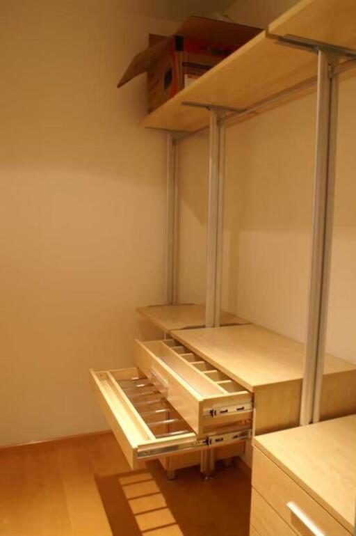 Organized closet with shelving and drawers