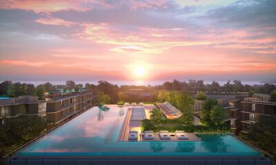 Luxurious residential complex with an infinity pool at sunset