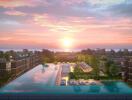 Modern apartment complex with infinity pool at sunset