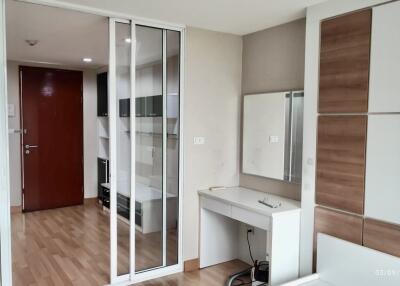 Modern bedroom with integrated workspace and storage solutions