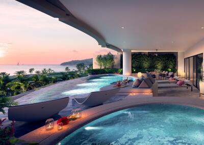 Luxurious outdoor lounge area with pools and ocean view at sunset