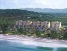 Beachfront luxury apartments with scenic mountain backdrop