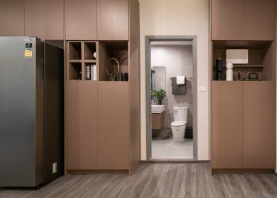 Modern kitchen view with a glimpse of the bathroom