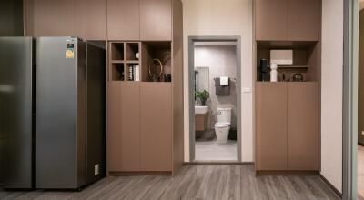 Modern kitchen view with a glimpse of the bathroom