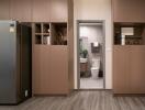 Modern kitchen view with a glimpse of the bathroom