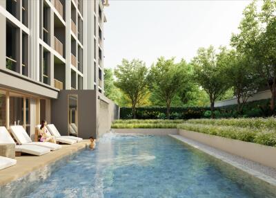 Outdoor pool area with lounge chairs and greenery