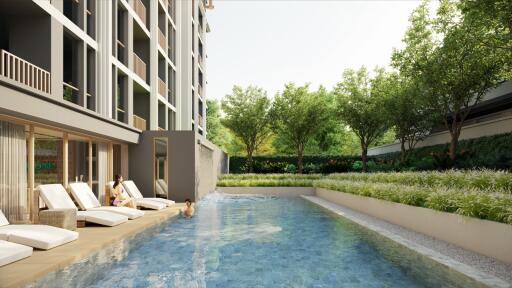 Outdoor pool area with lounge chairs and greenery