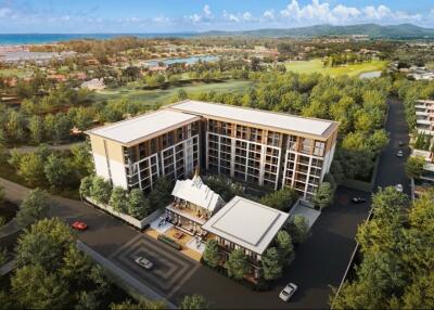 Aerial view of a modern residential building complex surrounded by greenery