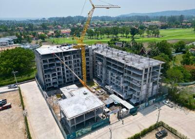 Construction site of a multi-story residential building with crane