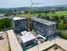 Construction site of a multi-story residential building with crane