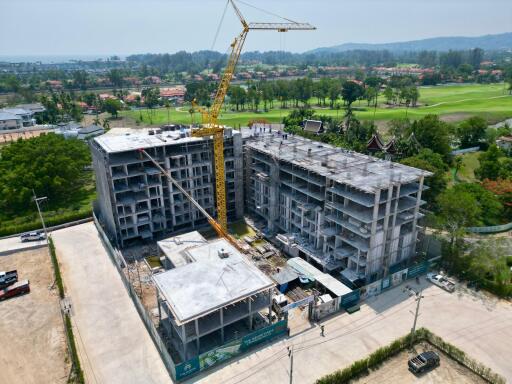 Construction site of a multi-story residential building with crane