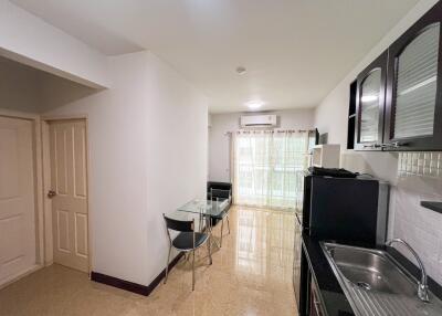 Modern kitchen with dining area and natural lighting