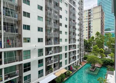 View of apartment buildings with a swimming pool