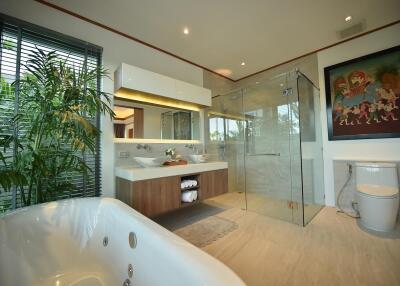 Modern bathroom with glass shower and bathtub