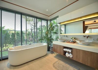 Modern bathroom with large bathtub and double sinks