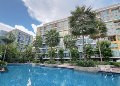 Modern condominium complex with outdoor pool