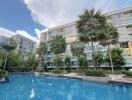 Modern condominium complex with outdoor pool