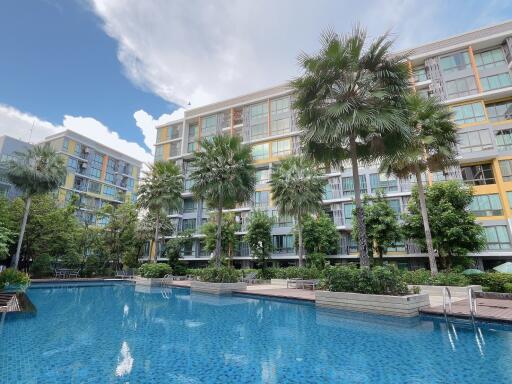 Modern condominium complex with outdoor pool