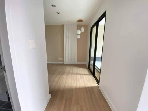 Modern living space with wooden flooring and large windows