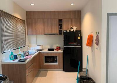 Modern kitchen with wooden cabinets and appliances