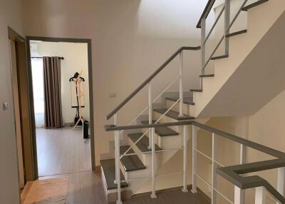 Modern staircase and hallway with natural lighting