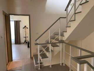 Modern staircase and hallway with natural lighting