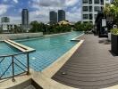 Outdoor pool area with lounge chairs and greenery