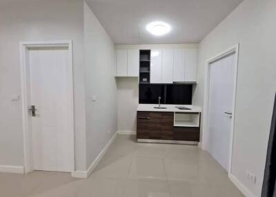 Modern minimalist kitchen with white and dark brown cabinets