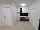 Modern minimalist kitchen with white and dark brown cabinets