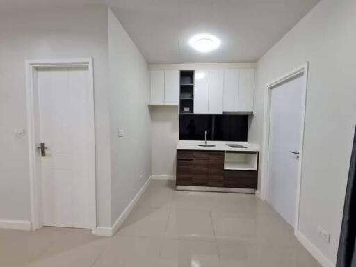 Modern minimalist kitchen with white and dark brown cabinets