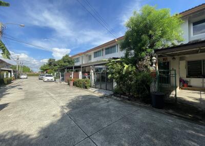 View of residential street with multiple houses and cars