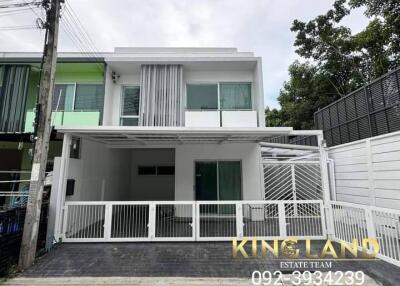 Modern two-story residential building with a garage